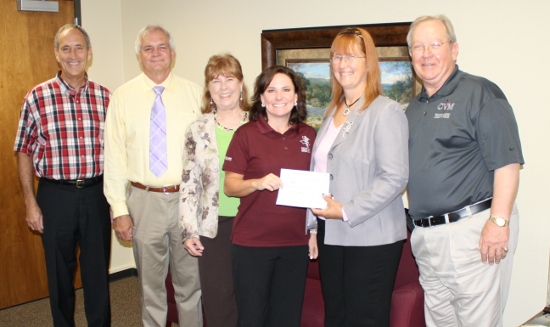 Scholarship Committee presents check to Vet School officials.